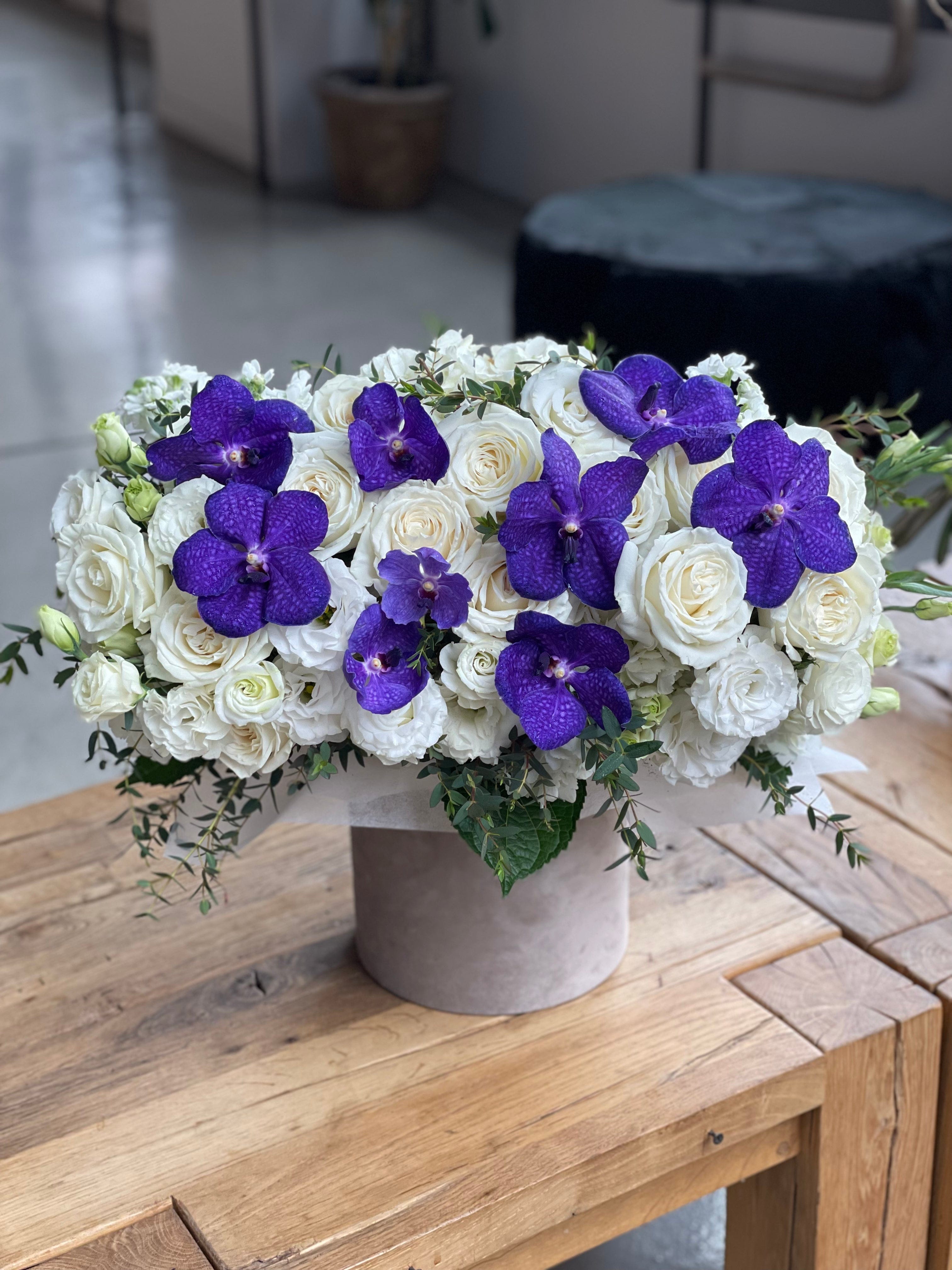 Box with purple orchids