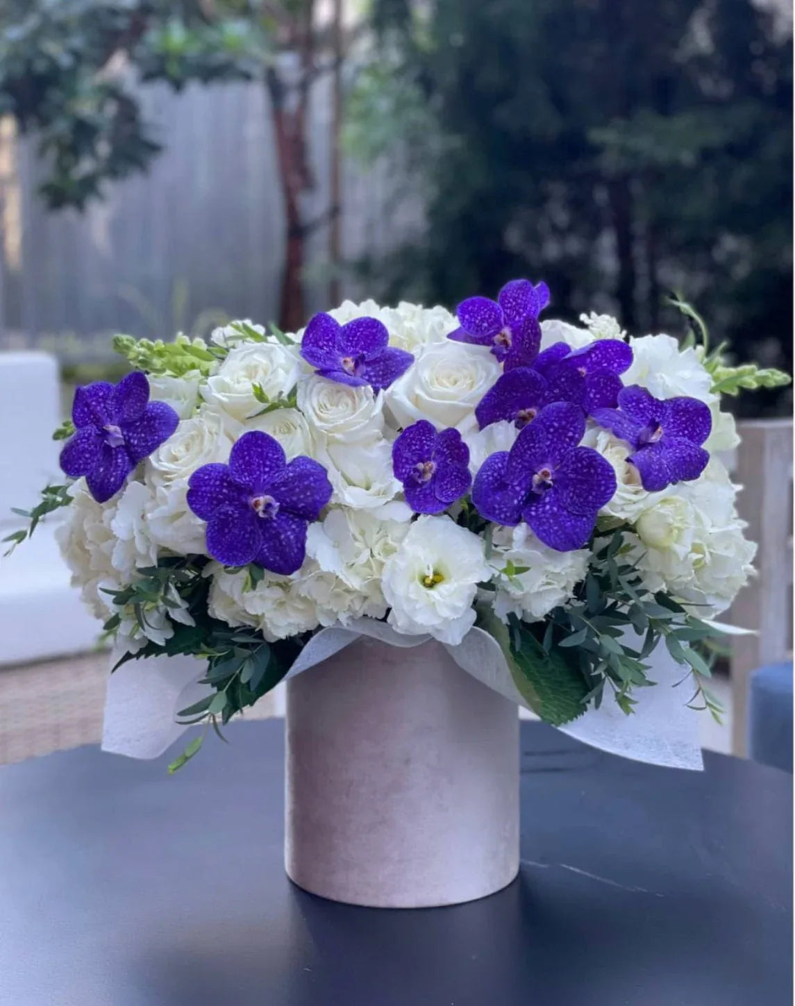 Box with purple orchids