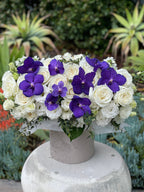 Box with purple orchids