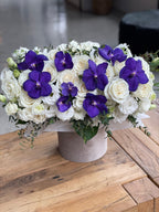 Box with purple orchids
