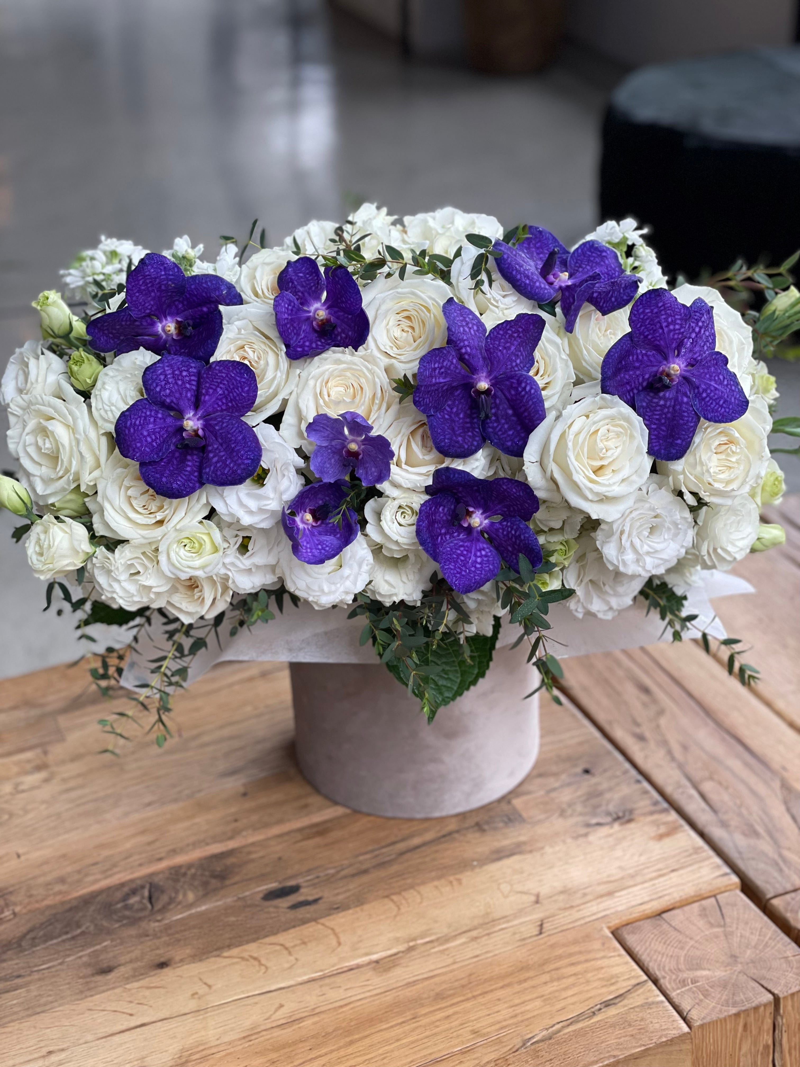 Box with purple orchids