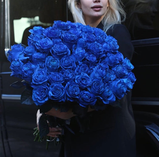 500 blue roses with vase,100 blue balloons ,25 long stem roses plus 25 long stem roses plus 2 packs of blue petals